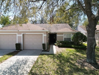 Welcome to this cozy 2-bedroom, 2-bathroom villa in the Lake on The Links of Lake Bernadette in Florida - for sale on GolfHomes.com, golf home, golf lot