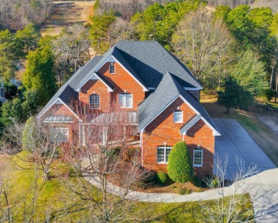 Welcome to this elegant brick home in a prime Tega Cay location on Tega Cay Golf Club in South Carolina - for sale on GolfHomes.com, golf home, golf lot