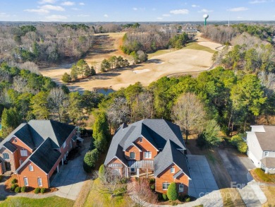 Welcome to this elegant brick home in a prime Tega Cay location on Tega Cay Golf Club in South Carolina - for sale on GolfHomes.com, golf home, golf lot