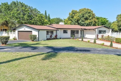 Stunning 4-bedroom, 3-full-bath oasis is nestled in the on Fort Lauderdale Country Club in Florida - for sale on GolfHomes.com, golf home, golf lot