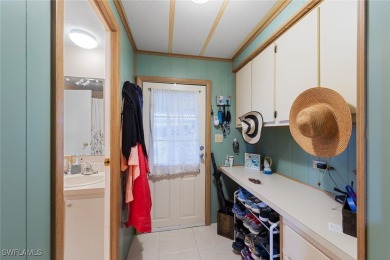 Enjoy living the Naples lifestyle in this light and bright well on Riviera Golf Club in Florida - for sale on GolfHomes.com, golf home, golf lot