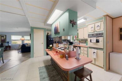 Enjoy living the Naples lifestyle in this light and bright well on Riviera Golf Club in Florida - for sale on GolfHomes.com, golf home, golf lot