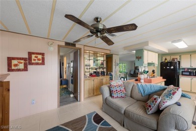 Enjoy living the Naples lifestyle in this light and bright well on Riviera Golf Club in Florida - for sale on GolfHomes.com, golf home, golf lot