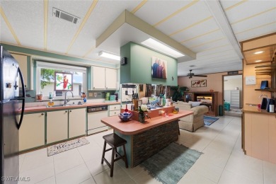 Enjoy living the Naples lifestyle in this light and bright well on Riviera Golf Club in Florida - for sale on GolfHomes.com, golf home, golf lot