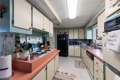 Enjoy living the Naples lifestyle in this light and bright well on Riviera Golf Club in Florida - for sale on GolfHomes.com, golf home, golf lot