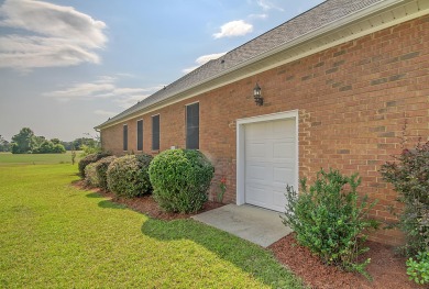 This inviting brick ranch home is tucked away in a quiet gated on Players Course At Wyboo Plantation in South Carolina - for sale on GolfHomes.com, golf home, golf lot
