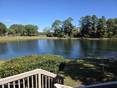 Live lakeside with water views from the kitchen, living area on Harbour Point Golf Club in North Carolina - for sale on GolfHomes.com, golf home, golf lot