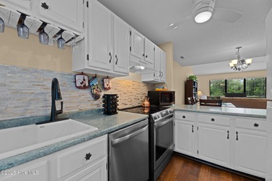 Live lakeside with water views from the kitchen, living area on Harbour Point Golf Club in North Carolina - for sale on GolfHomes.com, golf home, golf lot