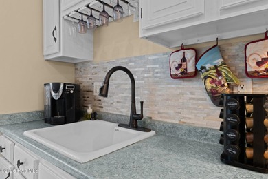 Live lakeside with water views from the kitchen, living area on Harbour Point Golf Club in North Carolina - for sale on GolfHomes.com, golf home, golf lot