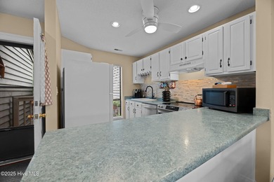 Live lakeside with water views from the kitchen, living area on Harbour Point Golf Club in North Carolina - for sale on GolfHomes.com, golf home, golf lot