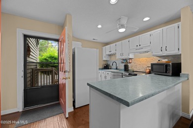 Live lakeside with water views from the kitchen, living area on Harbour Point Golf Club in North Carolina - for sale on GolfHomes.com, golf home, golf lot