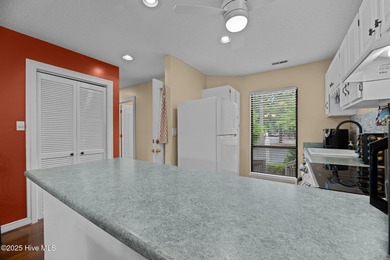 Live lakeside with water views from the kitchen, living area on Harbour Point Golf Club in North Carolina - for sale on GolfHomes.com, golf home, golf lot