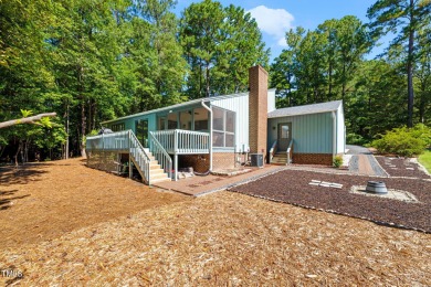 Discover this adorable 3-bedroom, 2-bath cottage tucked away on on Carolina Trace Country Club in North Carolina - for sale on GolfHomes.com, golf home, golf lot