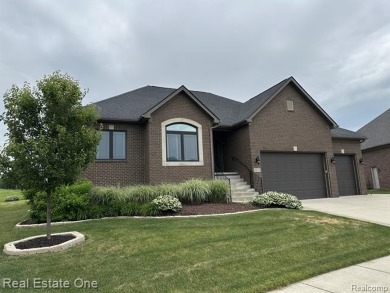 Custom built ranch with finished basement & a covered 288 sf on The Orchards Golf Club in Michigan - for sale on GolfHomes.com, golf home, golf lot