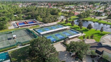EXPERIENCE THE PINNACLE OF FLORIDA LIVING IN THIS REFINED on Sandpiper Golf Club in Florida - for sale on GolfHomes.com, golf home, golf lot