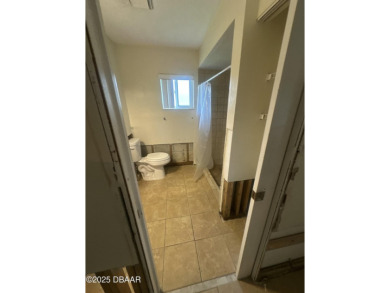 Are you an investor or homebuyer looking for a project? This on Daytona Beach Golf Club in Florida - for sale on GolfHomes.com, golf home, golf lot