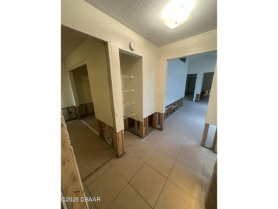 Are you an investor or homebuyer looking for a project? This on Daytona Beach Golf Club in Florida - for sale on GolfHomes.com, golf home, golf lot