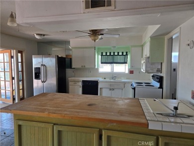 This home offers incredible potential for the right buyer or on Sands RV and Golf Resort in California - for sale on GolfHomes.com, golf home, golf lot