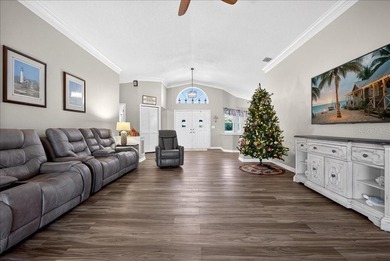 Refined Florida living awaits in this beautifully maintained on The Grand Club - Pine Lakes Course in Florida - for sale on GolfHomes.com, golf home, golf lot