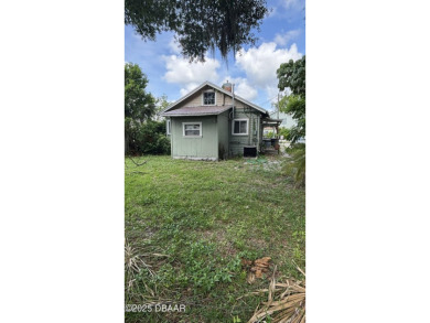 Here's your chance to renovate a home in the highly desirable on New Smyrna Beach Golf Course in Florida - for sale on GolfHomes.com, golf home, golf lot