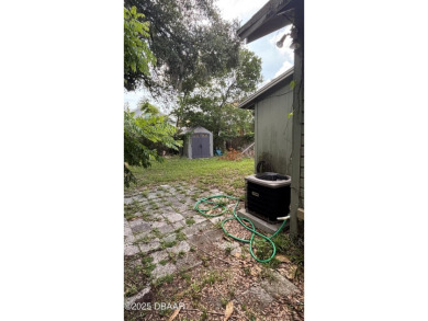 Here's your chance to renovate a home in the highly desirable on New Smyrna Beach Golf Course in Florida - for sale on GolfHomes.com, golf home, golf lot