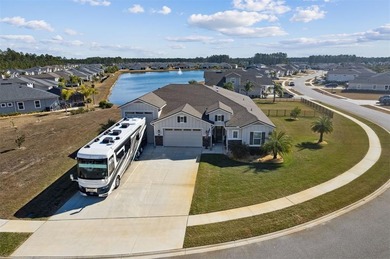 RV Garage home with waterfront living at its best, on a spacious on Golf Club At North Hampton in Florida - for sale on GolfHomes.com, golf home, golf lot