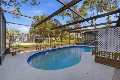 One or more photo(s) has been virtually staged. Step inside and on Oak Hills Country Club in Florida - for sale on GolfHomes.com, golf home, golf lot