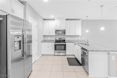 Welcome to a beautifully maintained townhome located in the on Gateway Golf and Country Club in Florida - for sale on GolfHomes.com, golf home, golf lot