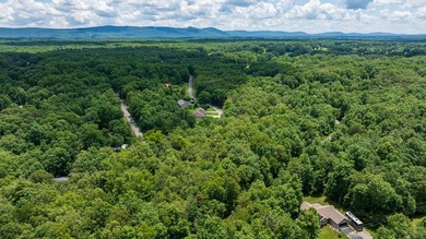 Imagine building your getaway in a quiet, wooded setting just on Lake Tansi Village Country Club in Tennessee - for sale on GolfHomes.com, golf home, golf lot