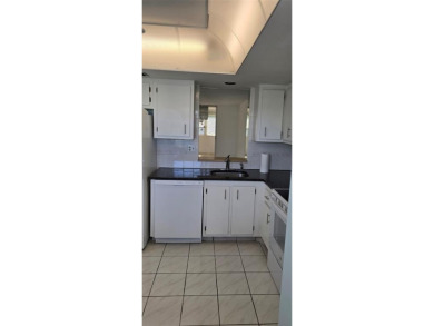 Spacious and bright 2-bed, 2-bath + den/office condo in Palm on Oriole Golf and Tennis Club in Florida - for sale on GolfHomes.com, golf home, golf lot