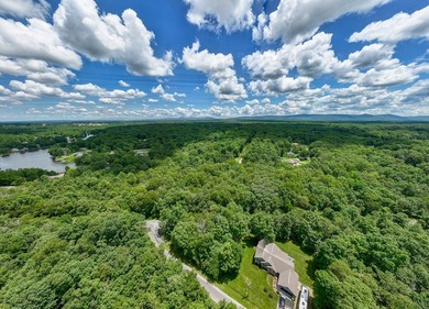 Imagine building your getaway in a quiet, wooded setting just on Lake Tansi Village Country Club in Tennessee - for sale on GolfHomes.com, golf home, golf lot