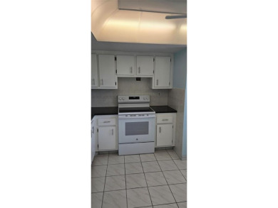 Spacious and bright 2-bed, 2-bath + den/office condo in Palm on Oriole Golf and Tennis Club in Florida - for sale on GolfHomes.com, golf home, golf lot