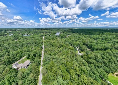Imagine building your getaway in a quiet, wooded setting just on Lake Tansi Village Country Club in Tennessee - for sale on GolfHomes.com, golf home, golf lot