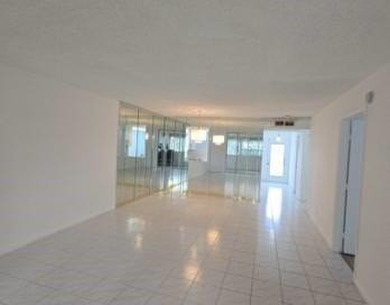 Spacious and bright 2-bed, 2-bath + den/office condo in Palm on Oriole Golf and Tennis Club in Florida - for sale on GolfHomes.com, golf home, golf lot