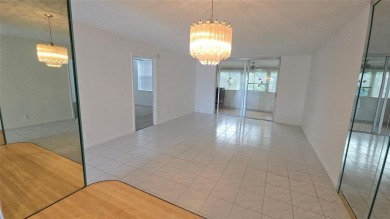 Spacious and bright 2-bed, 2-bath + den/office condo in Palm on Oriole Golf and Tennis Club in Florida - for sale on GolfHomes.com, golf home, golf lot