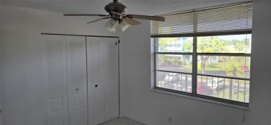 Spacious and bright 2-bed, 2-bath + den/office condo in Palm on Oriole Golf and Tennis Club in Florida - for sale on GolfHomes.com, golf home, golf lot
