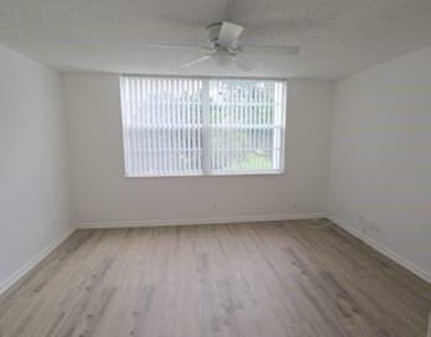 Spacious and bright 2-bed, 2-bath + den/office condo in Palm on Oriole Golf and Tennis Club in Florida - for sale on GolfHomes.com, golf home, golf lot