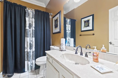 Experience timeless elegance and custom craftsmanship in this on Diamondhead Country Club in Mississippi - for sale on GolfHomes.com, golf home, golf lot