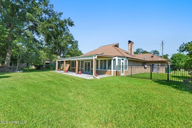 Experience timeless elegance and custom craftsmanship in this on Diamondhead Country Club in Mississippi - for sale on GolfHomes.com, golf home, golf lot
