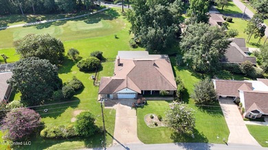 Experience timeless elegance and custom craftsmanship in this on Diamondhead Country Club in Mississippi - for sale on GolfHomes.com, golf home, golf lot