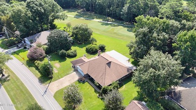 Experience timeless elegance and custom craftsmanship in this on Diamondhead Country Club in Mississippi - for sale on GolfHomes.com, golf home, golf lot