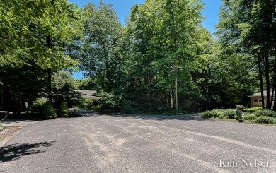 Looking to build your dream home? This beautifully wooded .98 on White Lake Golf Club in Michigan - for sale on GolfHomes.com, golf home, golf lot