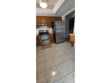 This cozy 3 bedroom, 2 bathroom pool home located in SW Cape on Royal Tee Country Club in Florida - for sale on GolfHomes.com, golf home, golf lot