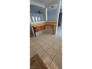 This cozy 3 bedroom, 2 bathroom pool home located in SW Cape on Royal Tee Country Club in Florida - for sale on GolfHomes.com, golf home, golf lot