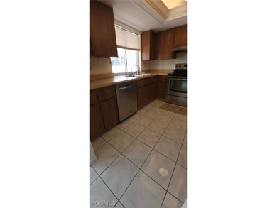 This cozy 3 bedroom, 2 bathroom pool home located in SW Cape on Royal Tee Country Club in Florida - for sale on GolfHomes.com, golf home, golf lot