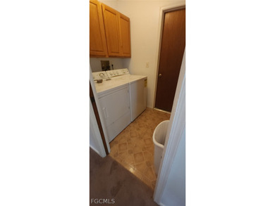 This cozy 3 bedroom, 2 bathroom pool home located in SW Cape on Royal Tee Country Club in Florida - for sale on GolfHomes.com, golf home, golf lot