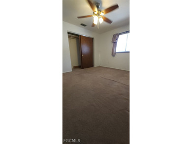 This cozy 3 bedroom, 2 bathroom pool home located in SW Cape on Royal Tee Country Club in Florida - for sale on GolfHomes.com, golf home, golf lot