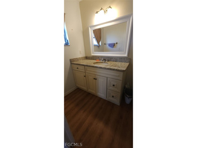 This cozy 3 bedroom, 2 bathroom pool home located in SW Cape on Royal Tee Country Club in Florida - for sale on GolfHomes.com, golf home, golf lot