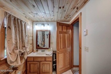 This gorgeous log home truly embraces the ''life in the on The Hideout Golf in Pennsylvania - for sale on GolfHomes.com, golf home, golf lot