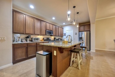 This beautifully maintained corner lot half duplex home is on Wildhorse Golf Club of Robson Ranch in Texas - for sale on GolfHomes.com, golf home, golf lot